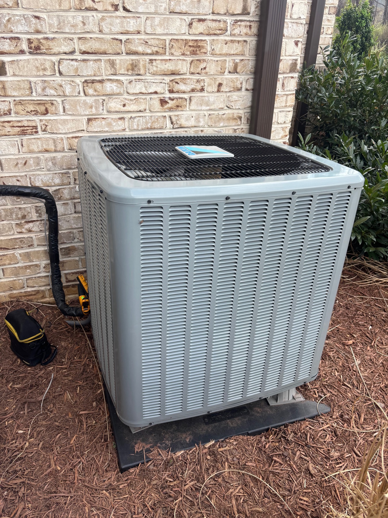 Outdoor heat pump equipment prepared for replacement and commissioning.