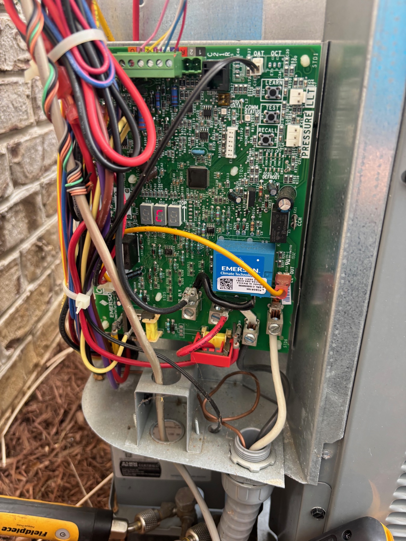 Outdoor HVAC electrical components checked during seasonal maintenance.
