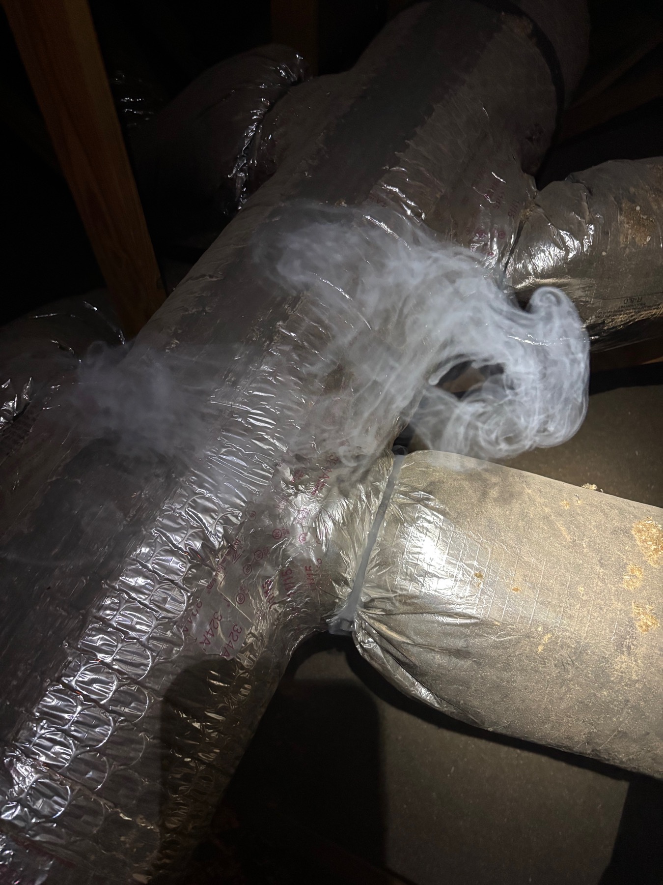 Insulated ductwork detail reviewed during a home performance visit.